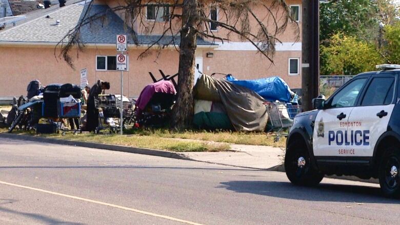 Edmonton police order campers to leave a property on 106th Avenue and 96th Street Thursday afternoon.