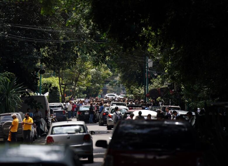 People stand in the street.