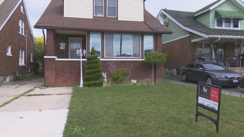 This home sits with a for sale sign on the front lawn, as it has since mid June.