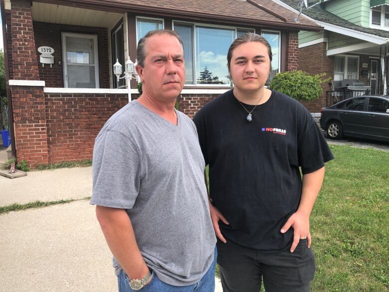 Mario and Michael Tersigni stand outside their home on Parent Avenue. It has been up for sale since mid-June.