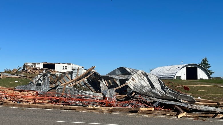 The remnants of a barn are seen