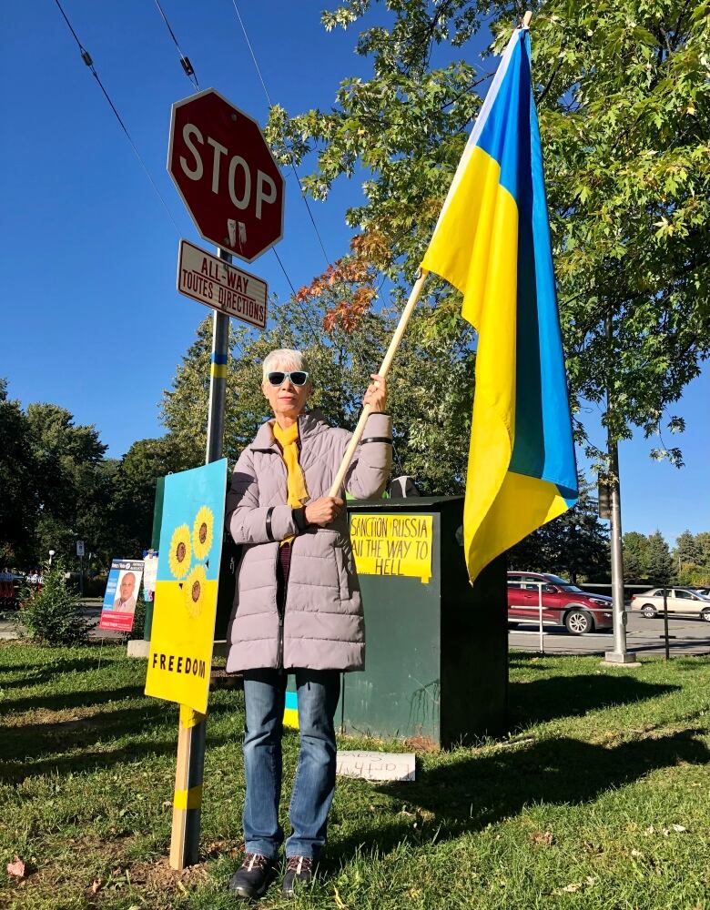 A woman with a Ukrainian flag.