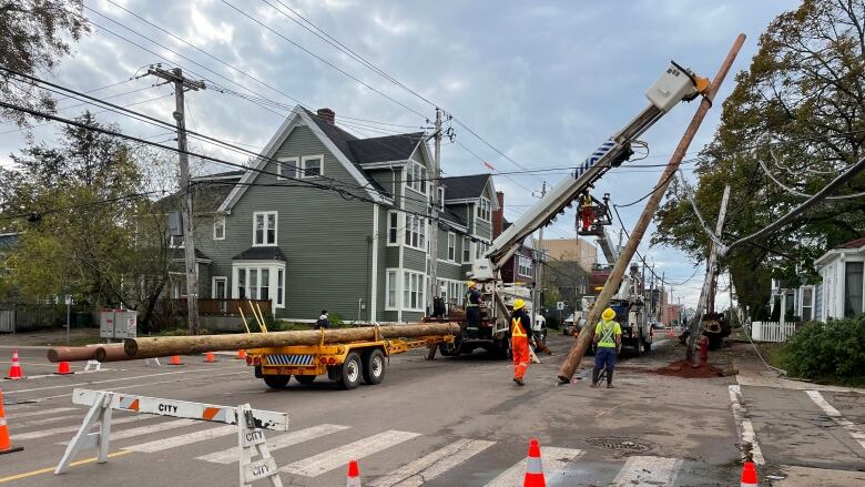 street blocked off with pylons as power crews replace a power pole in Charlottetown