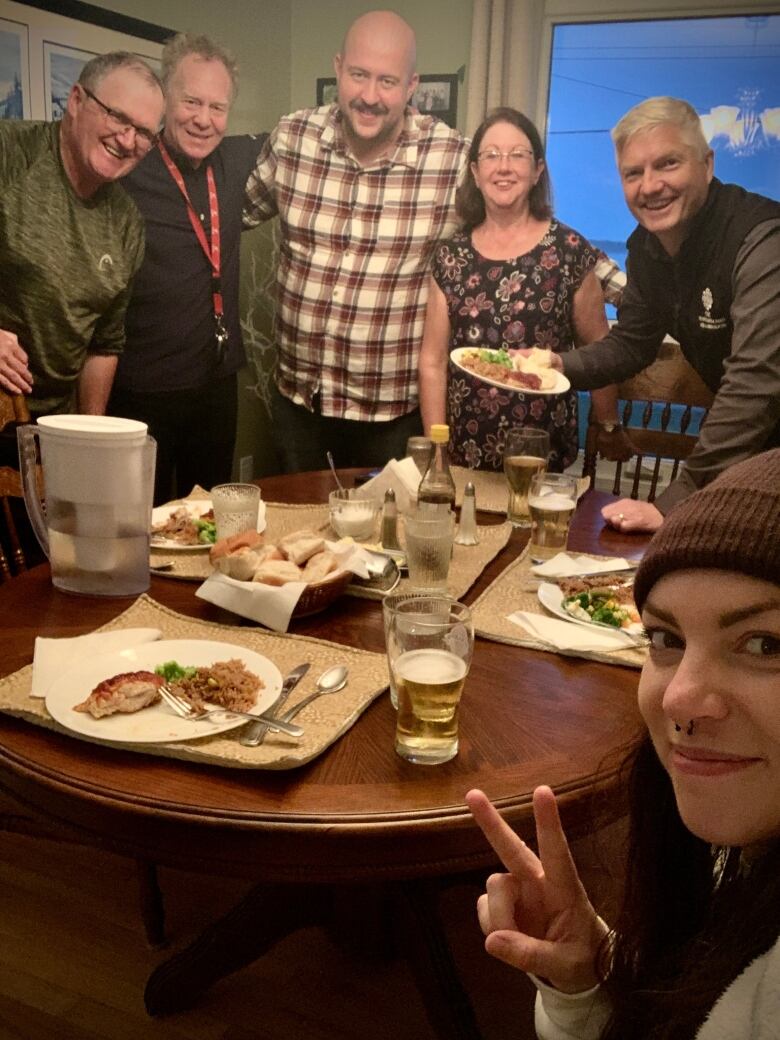 A group of people around a dinner table