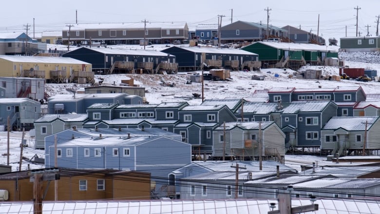 Multicoloured row housing on a slope. 