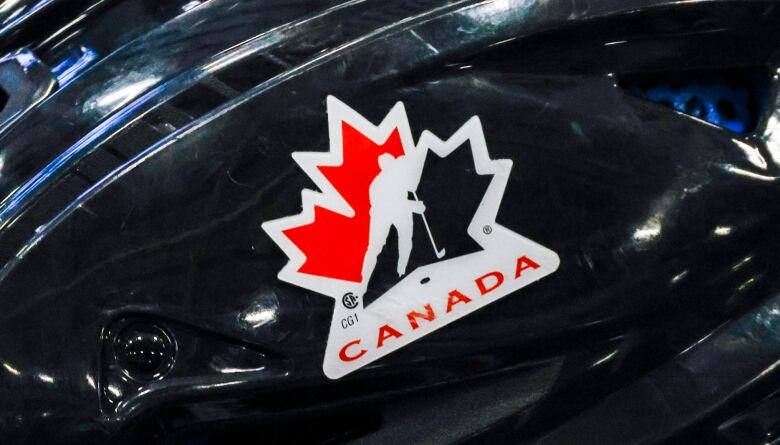 A hockey helmet with Canadian logo.