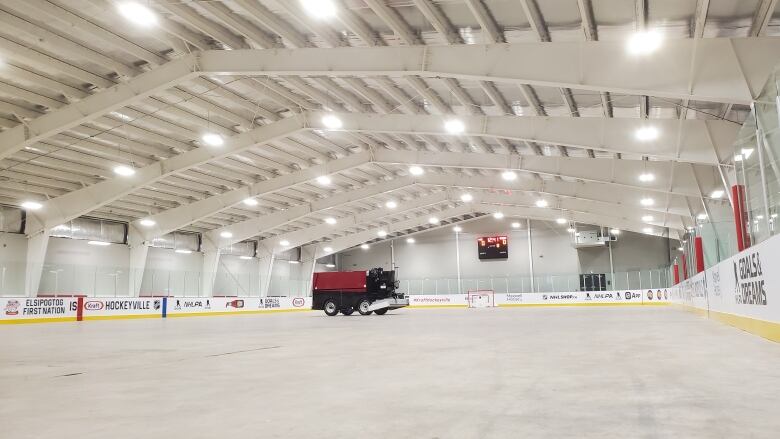 The interior of a hockey arena with a Zamboni.