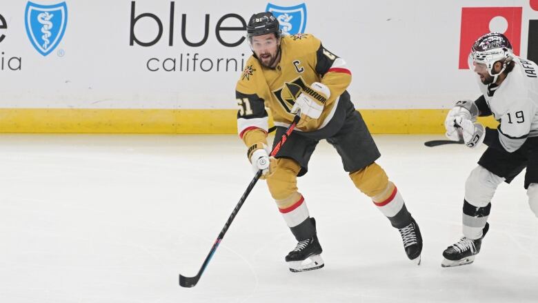 A player skates with the puck.