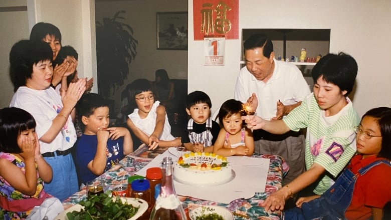 A family celebrates a birthday.