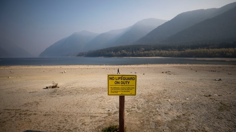 A sign telling swimmers there are no lifeguards on duty at Alouette Lake in Golden Ears Park, amid drought conditions on Tuesday, October 18, 2022 that saw the lake recede dramatically.