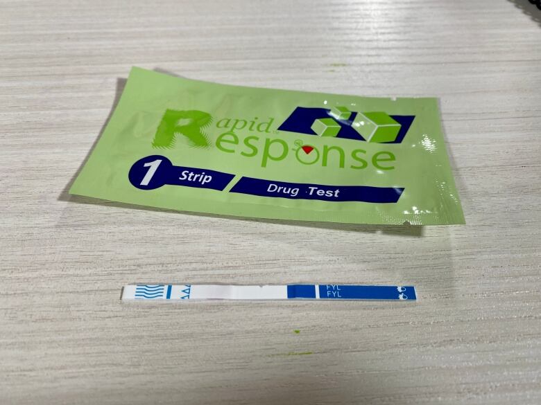 A 'rapid response' fentanyl test kit, with accompanying test strip.