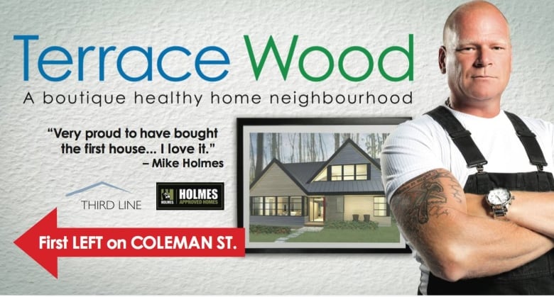 A billboard featuring Mike Holmes advertising the Terrace Wood housing development.