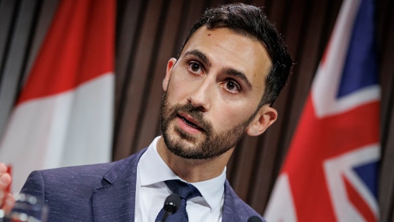 Education Minister Stephen Lecce speaks with members of the Queens Park press gallery on Oct. 31, 2022, after tabling legislation meant to halt a strike by CUPE-represented education workers.