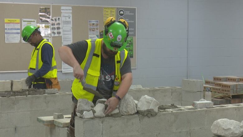 Erick Morin works on a masonry project in the Tomorrow's Trades program.