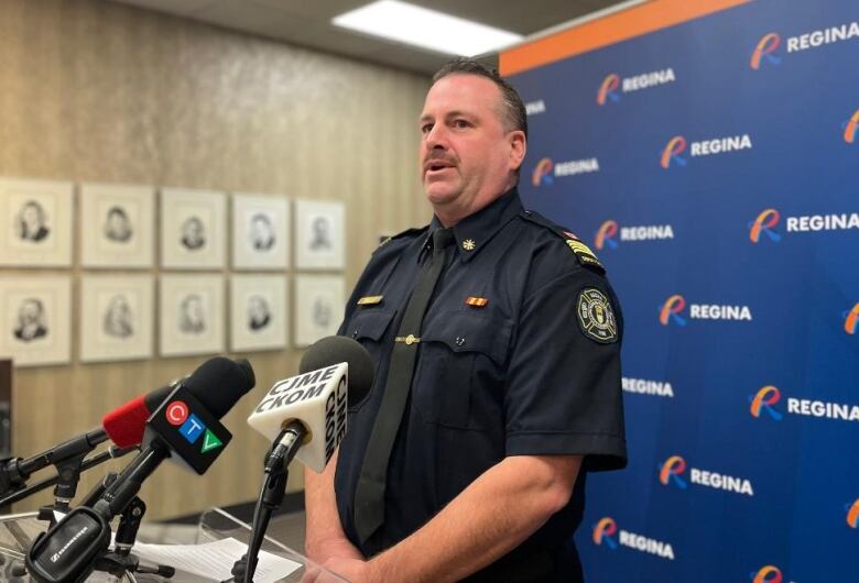 Man speaking at a press conference at Regina City Hall. 