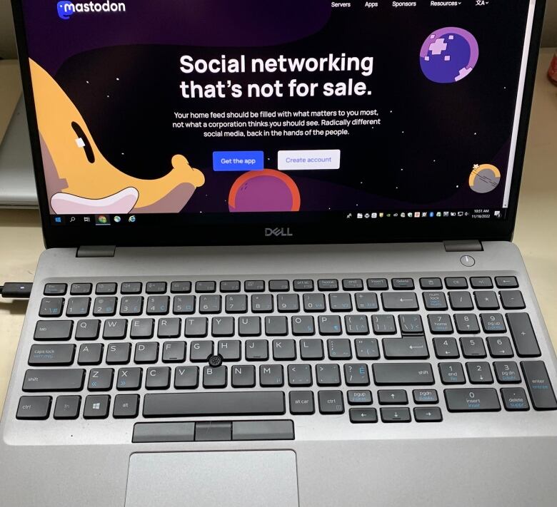 A laptop showing the homepage of a social network platform.