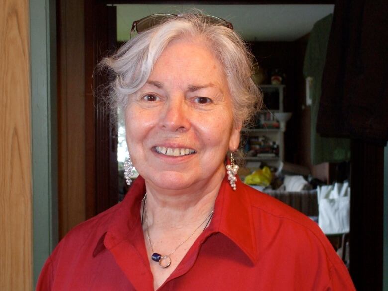 A woman wearing a red shirt 