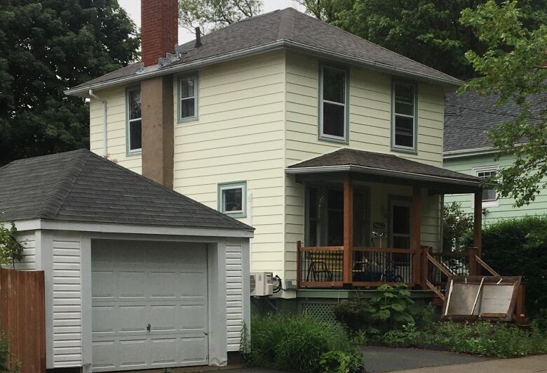 Two-storey yellow house. 