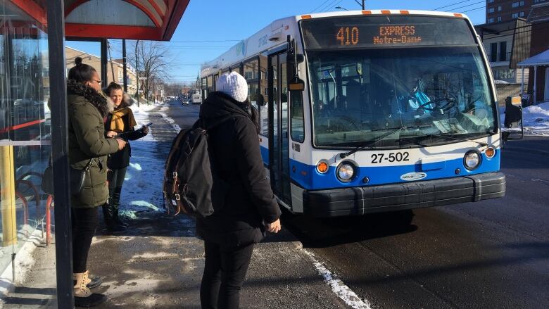 People are waiting for a bus.