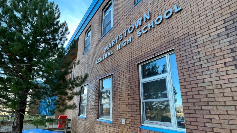 A brick building with the name 