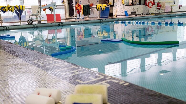 Pool noodles float in a swimming pool in Toronto on Friday, August 10, 2012.