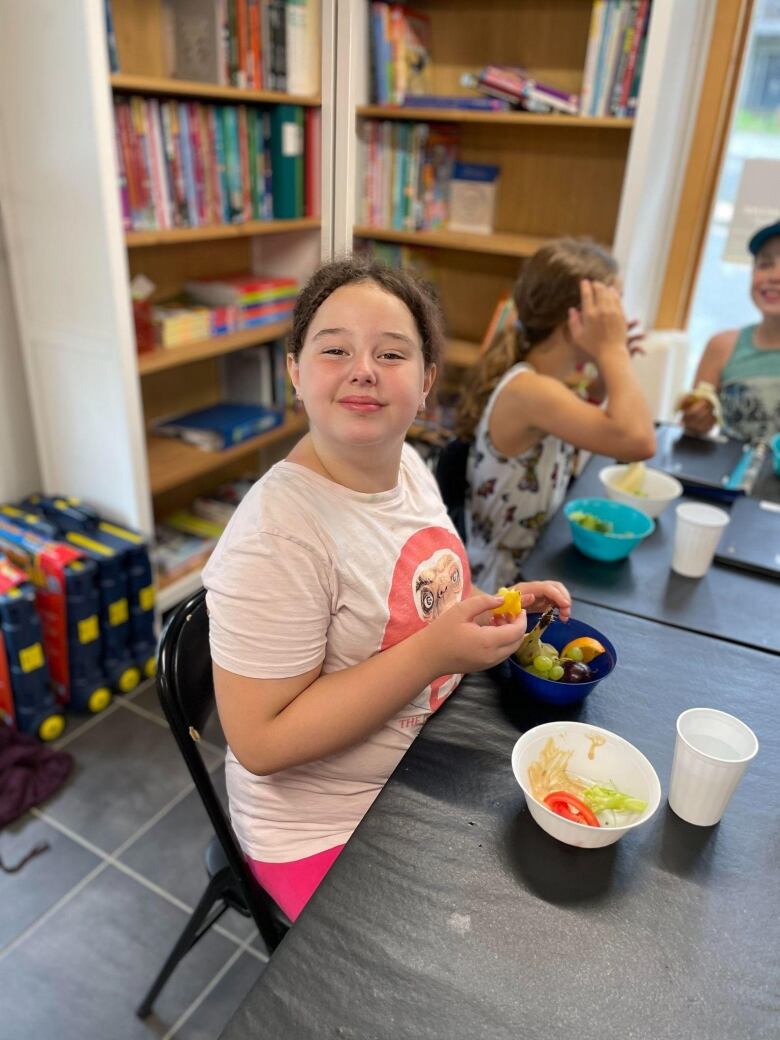 A child eats fruit.