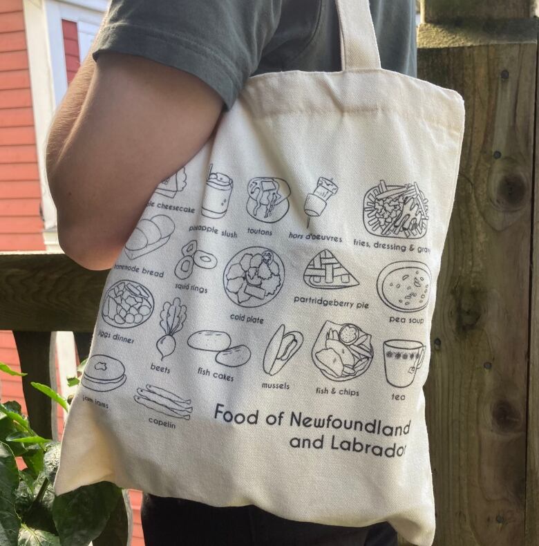 A canvas tote bag with pictures of classic Newfoundland and Labrador foods on it.