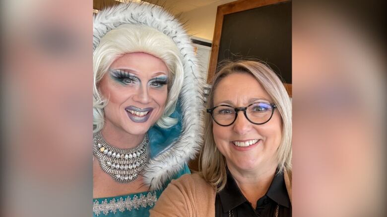 Drag performer dressed like Elsa from Frozen with book store owner