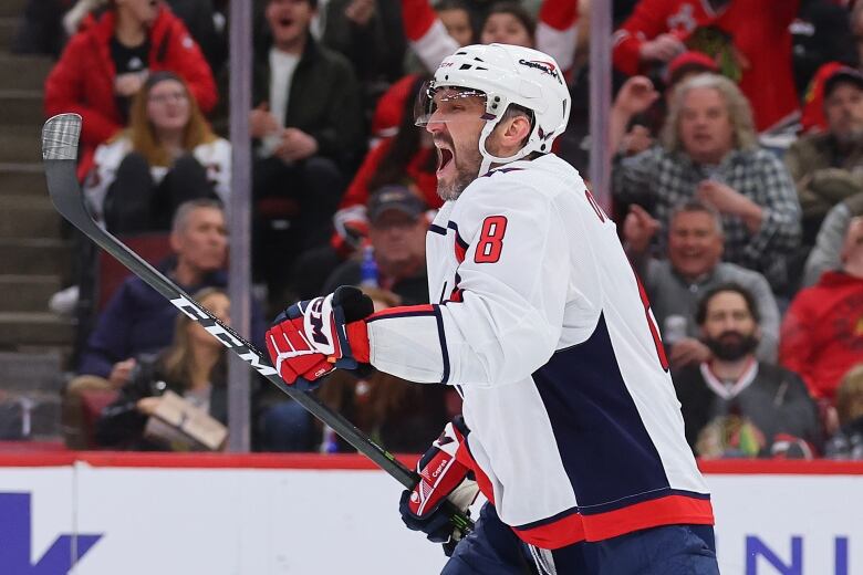 Alex Ovechkin celebrates the 800th goal of his NHL career in the Capitals away jersey in Chicago.