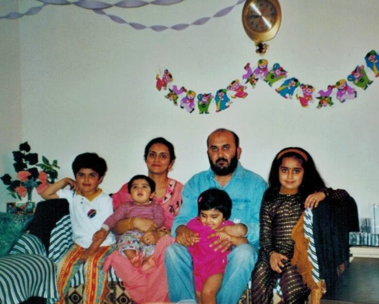 Old photo of Abudullah Usman with his family.