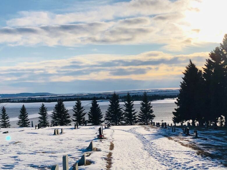 A snowy field is pictured on a sunny day.