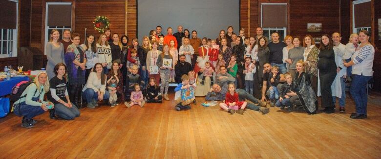 The group at the St. Nicholas Day celebrations pose together at the end of the event.