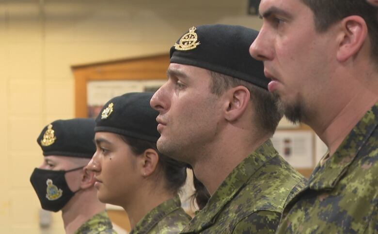 Soldiers standing in a row. 