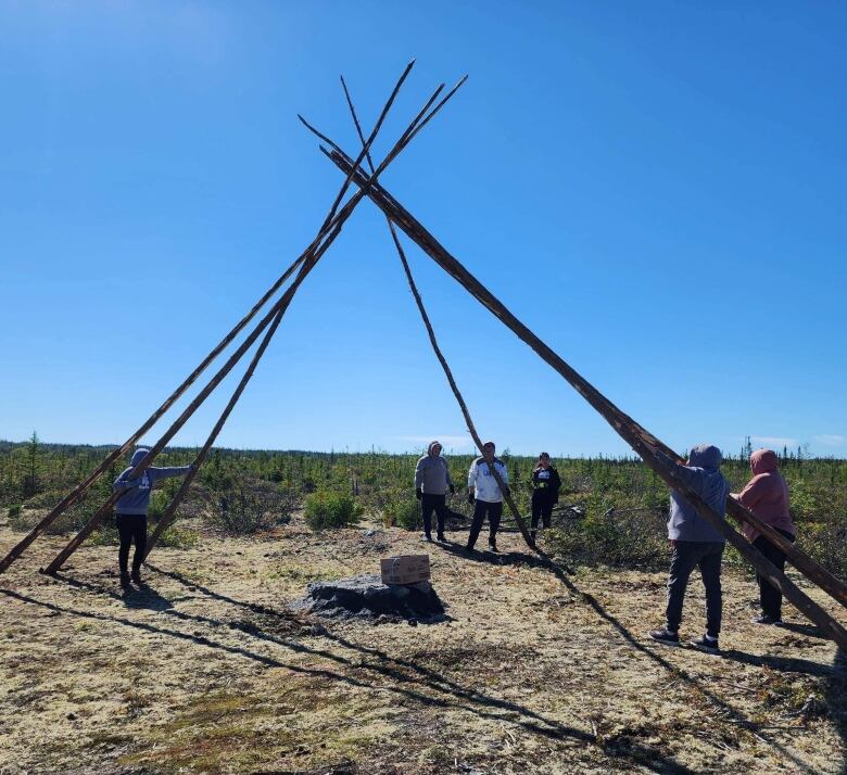 Friends and family helped build the traditional teepee about 10 km outside the Cree community of Chisasibi, Que. 