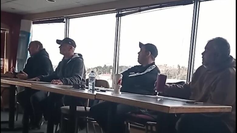 Members of Horse Racing N.B.'s board speak to horse owners at a meeting in Saint John Dec. 10. President Guy Barbara is on the left. Charlie Miles is next to him.