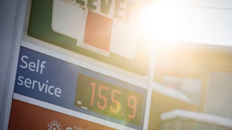 A sign shows the price of fuel at a gas station