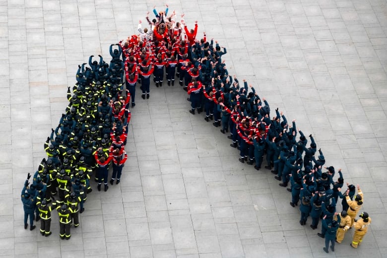 Russian Emergency Situation Ministry cadets stand in the shape of the letter V, which has become a symbol of the Russian military, during a National Unity Day celebration in Moscow on Nov. 4, 2022.