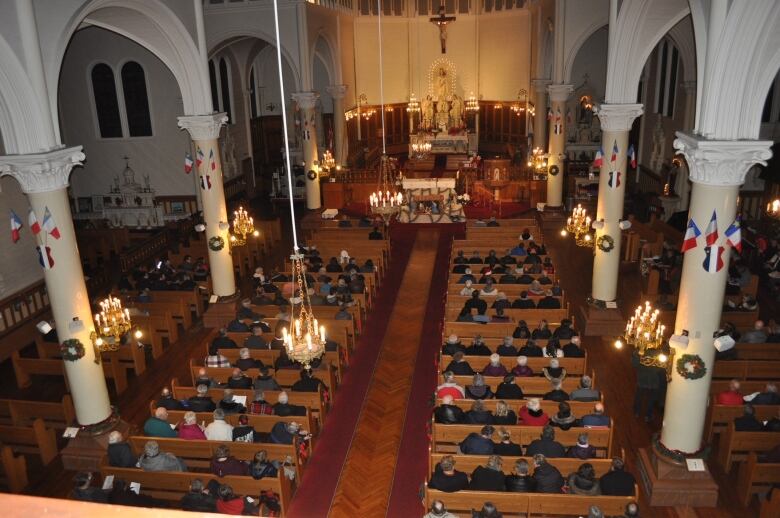 Worshippers are shown inside the church when it was still fit for people to go inside prior to Christmas 2019. 