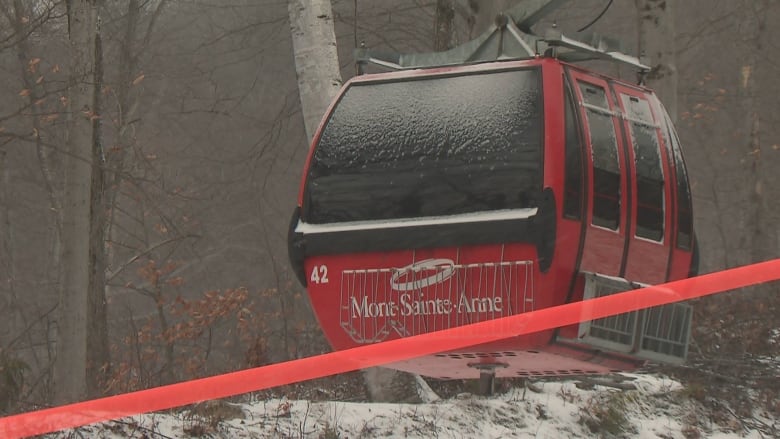 A gondola with red tape across it. 