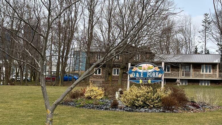 Sign that reads D & E Pork - one of the Islands largest hog producers - sits in front of a building in P.E.I. 