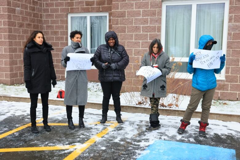 Kayla Borden and some of her supporters rally outside a Dartmouth hotel where the Nova Scotia Police Review Board is meeting to hear Borden's case.