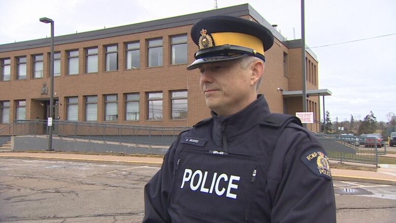 Const. Gavin Moore RCMP stands in uniform during an interview with CBC News. 