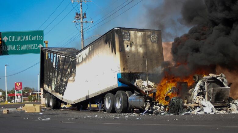 A truck burns on a street in Culiacan, Sinaloa state, Mexico.