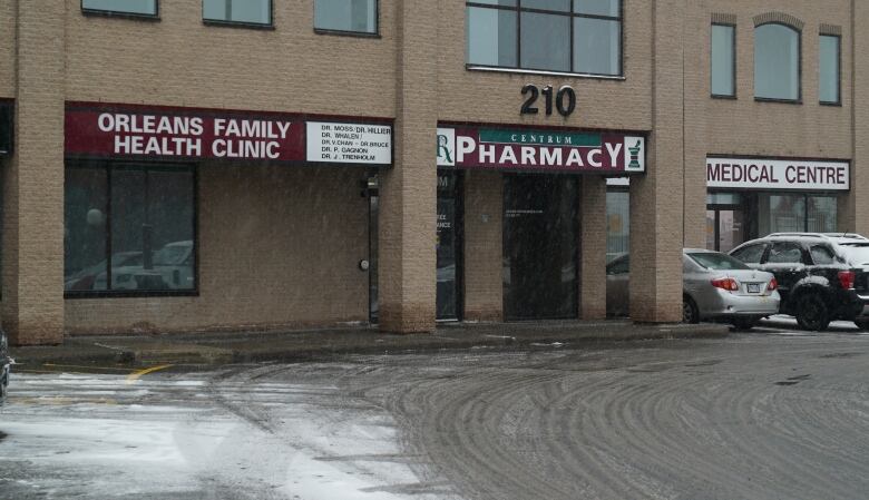 The Orlans Family Health Clinic located at Place Centrum on a snowy day.