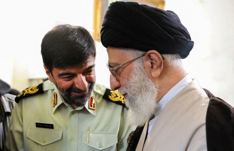 Iran's supreme leader is seen meeting with Ahmad-Reza Radan, the chief commander of the country's national police force, in Tehran.