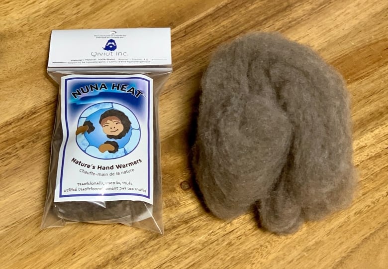 A packaged up piece of wool sits next to an unpackaged piece.