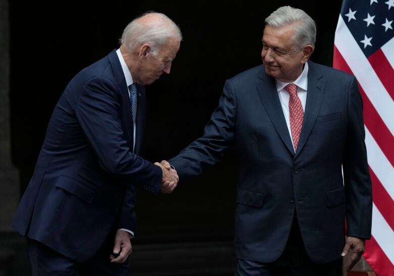 Mexico's President Andres Manuel Lopez Obrador and U.S. President Joe Biden shake hands at the National Palace in Mexico City, Monday, Jan. 9, 2023.