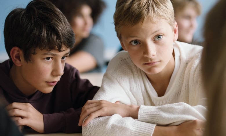 Actors Gustav De Waele and Eden Dambrine are seen in character in a scene from the film 