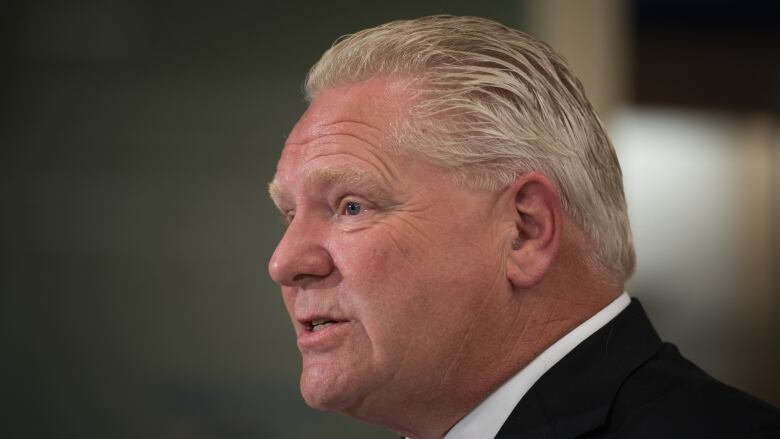 Ontario Premier Doug Ford answers questions following a  press conference at a Shoppers Drug Mart pharmacy in Etobicoke, Ont., on Wednesday, January 11, 2023.  THE CANADIAN PRESS/ Tijana Martin