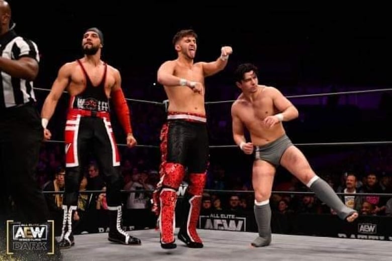 Sebastian Wolfe (left) stands in-ring moments before his AEW debut